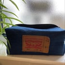 Blue denim wash bag. Boxy shape. Top zip fully opening. 