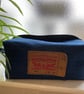 Blue denim wash bag. Boxy shape. Top zip fully opening. 