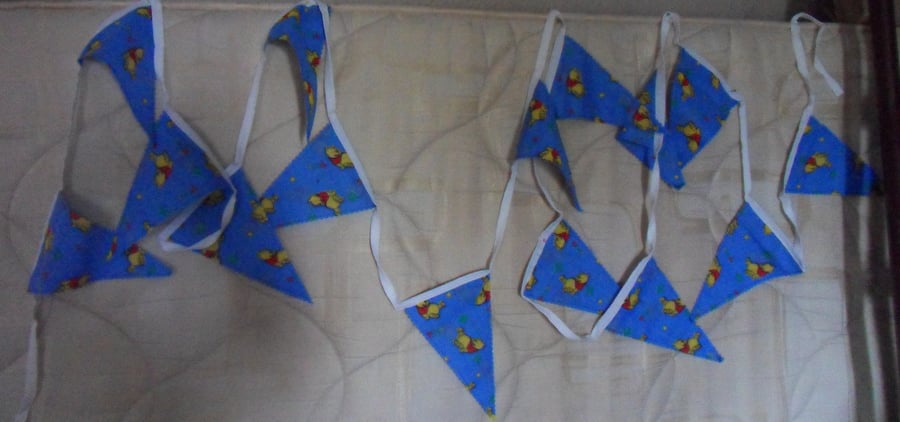 Homemade bunting. Winnie the Pooh on blue background. 5 meters