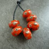 orange and ivory spot lampwork beads