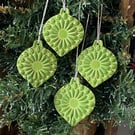 Set of four lightweight ceramic baubles green