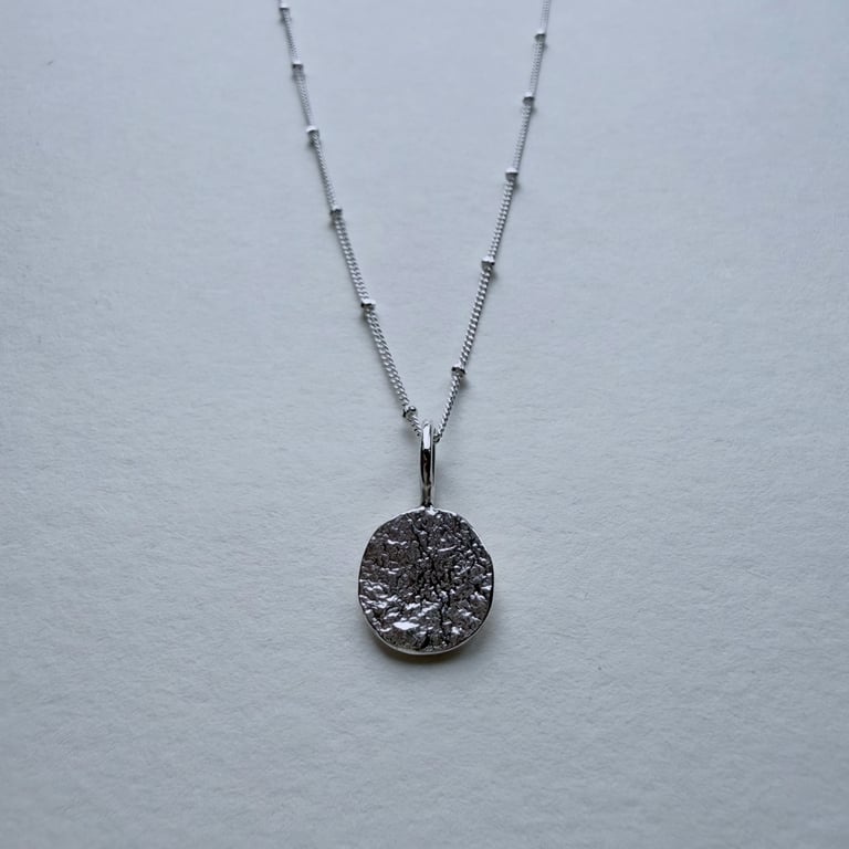 Reticulated Silver Coin Pendant