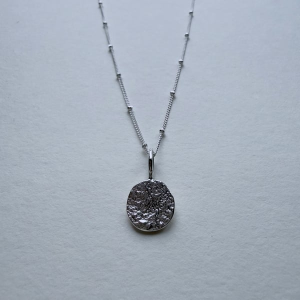 Reticulated Silver Coin Pendant