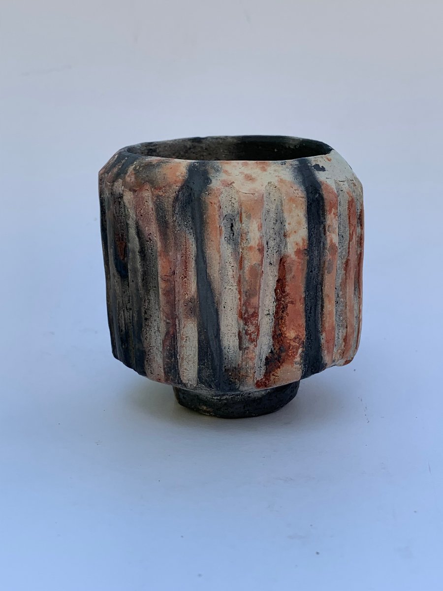 Carved, decorative pit fired pot