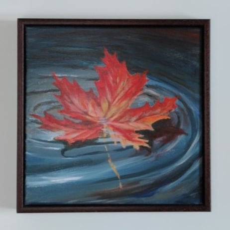 Gently Floating, Autumnal coloured leaf floating on water, origianal landscape