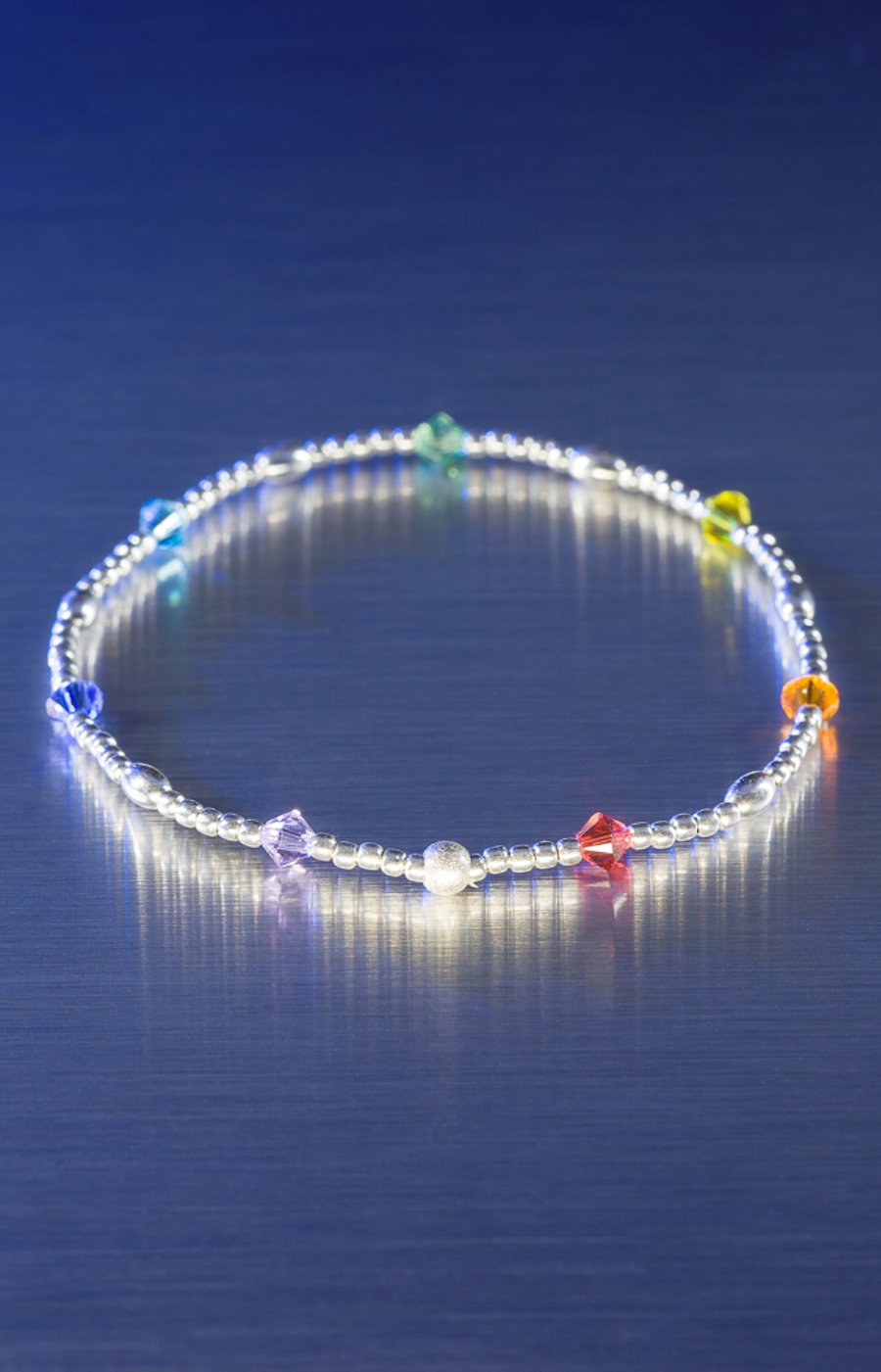 Sterling silver and Swarovski stretch bracelet in rainbow chakra colours