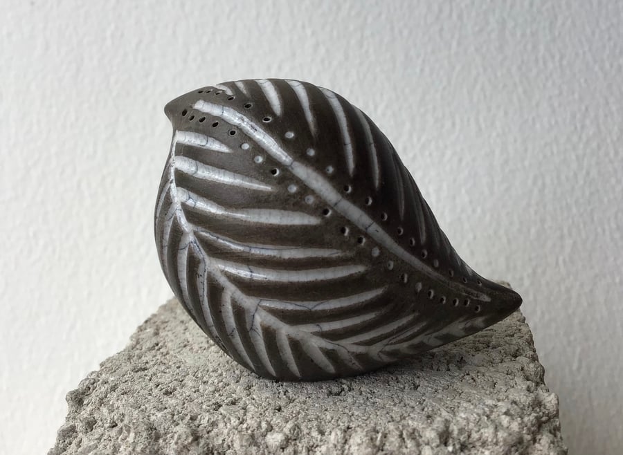 Carved raku baby bird