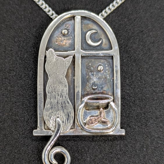 Sterling silver window pendant with cat and goldfish bowl with a red gold fish
