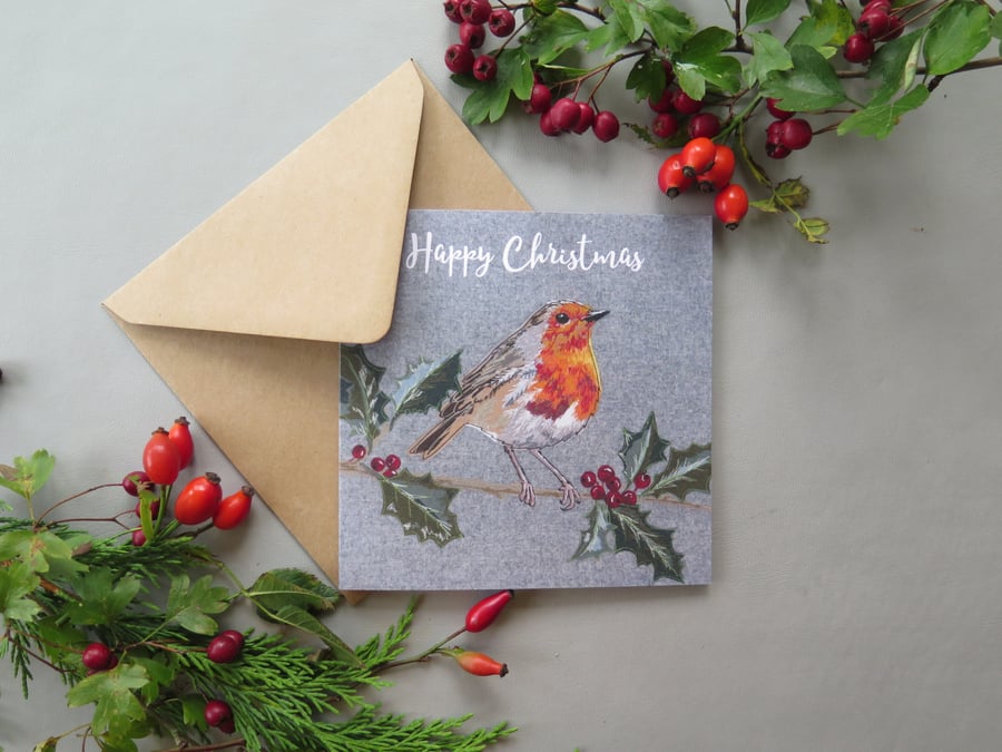 Robin on a holly branch Christmas card