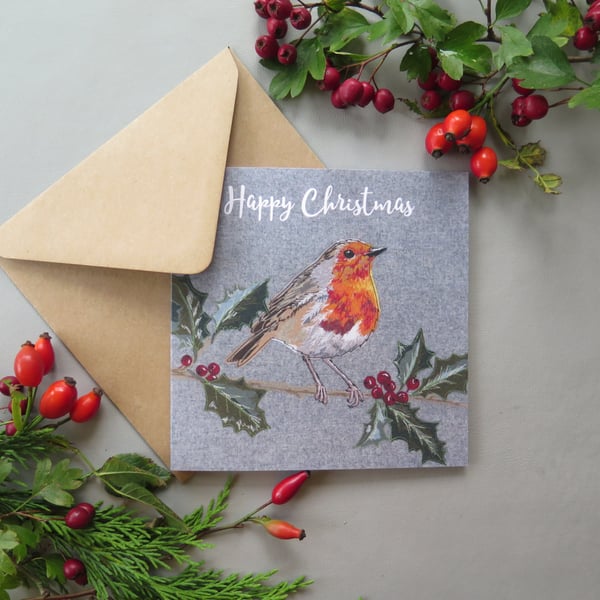 Robin on a holly branch Christmas card