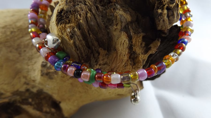 multi coloured memory wire bracelet with silver plated heart charms
