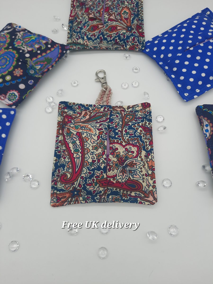 Bag charm sanitary towel holder in teal and raspberry pink pattern. 