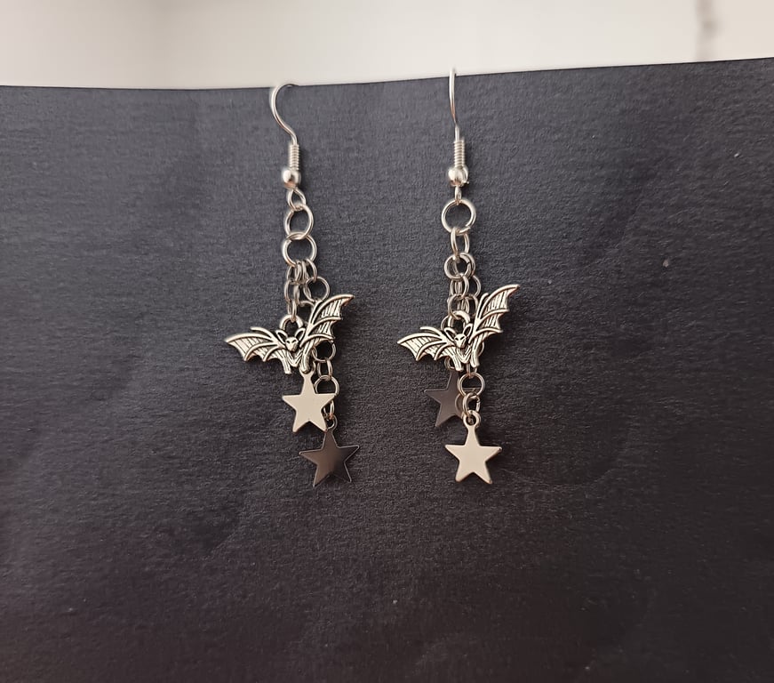 Silver bat and star charm cascade dangle earrings 