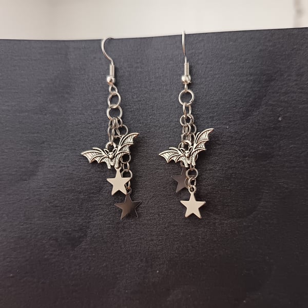 Silver bat and star charm cascade dangle earrings 