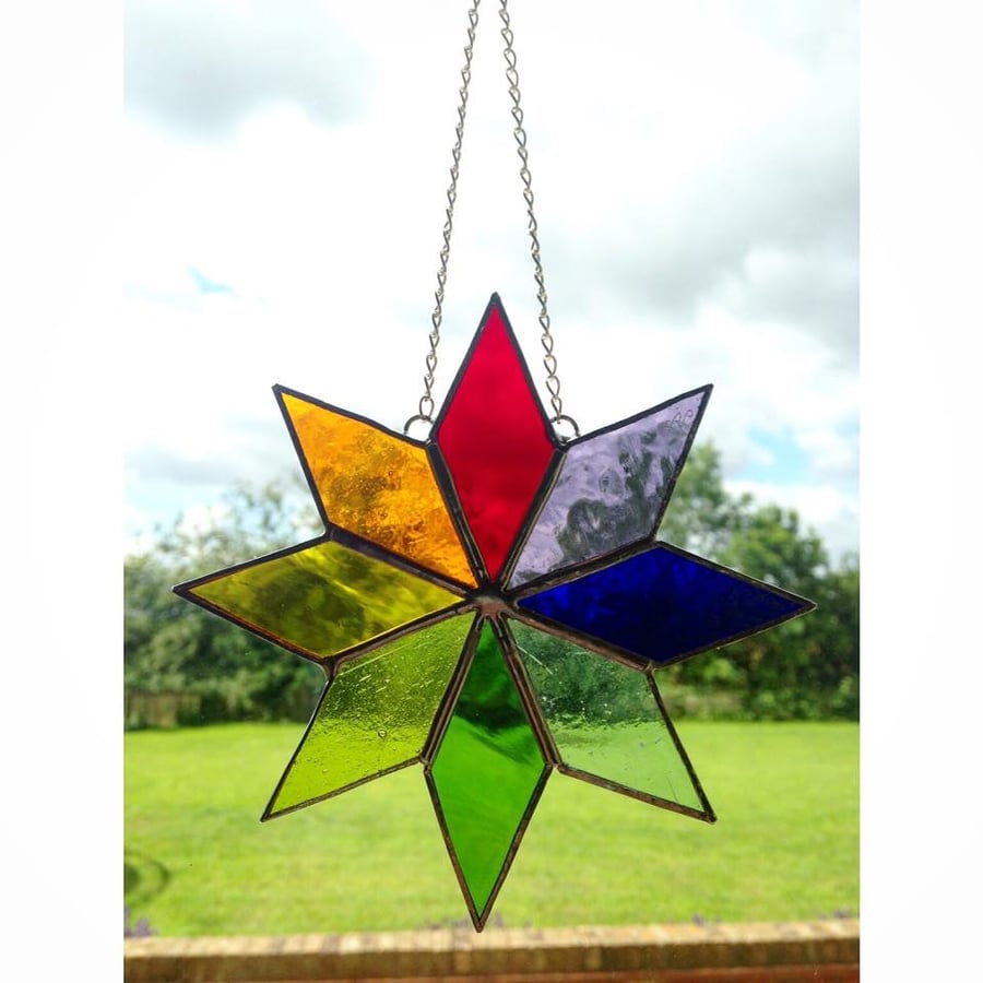 Stained glass rainbow coloured star, multi coloured stained glass suncatcher