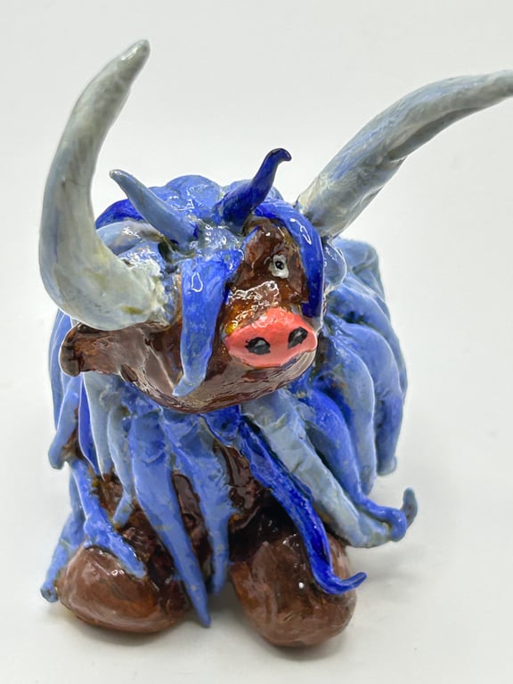 Blue highland cow. Handmade clay cattle 