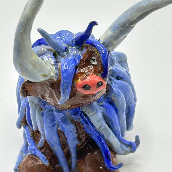 Blue highland cow. Handmade clay cattle 