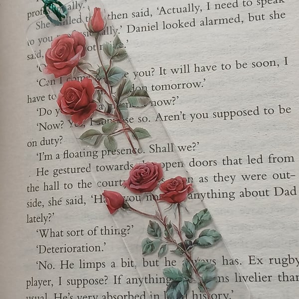 Clear acrylic bookmark decorated with red flowers decals 