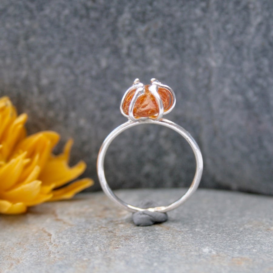 Silver and amber claw ring
