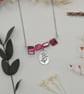 Pink mother of pearl beaded necklace with silver floral charm - Image 4