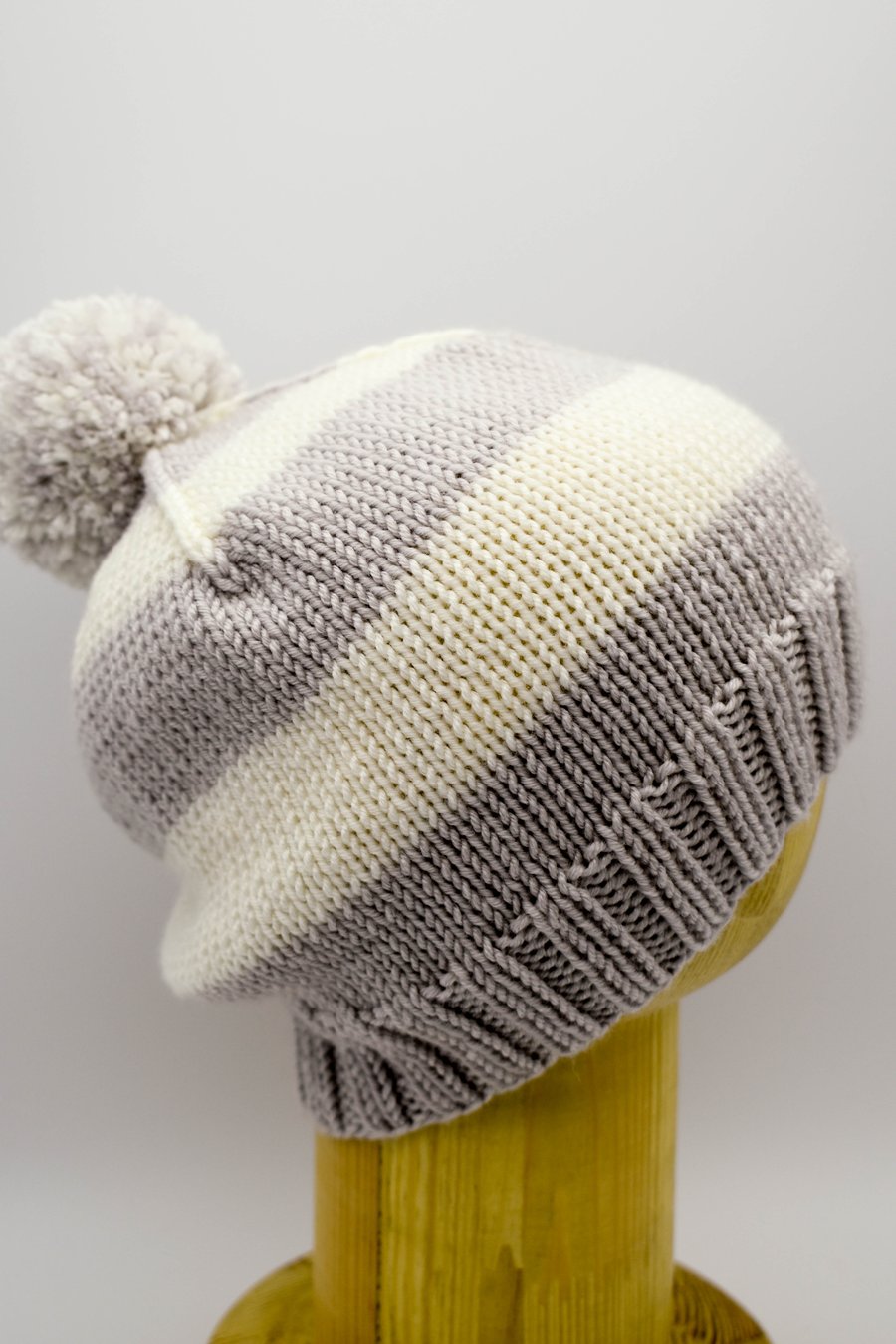 Hand knitted toddler hat in grey and white stripes