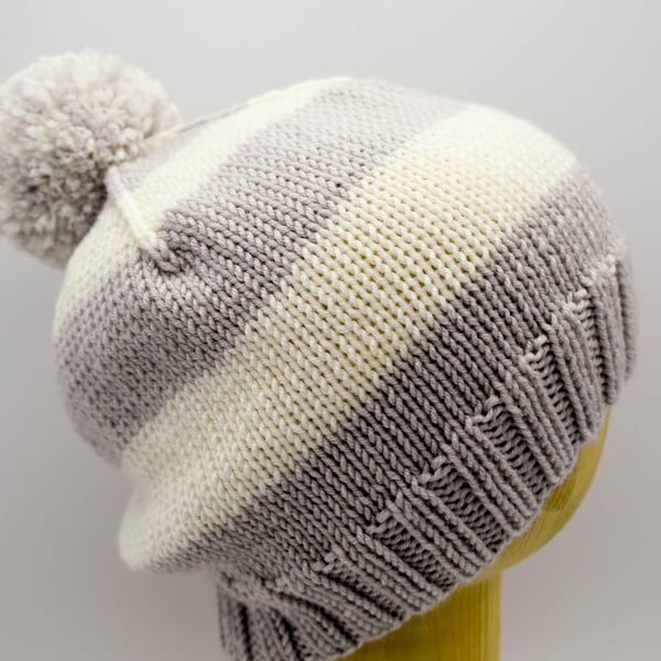 Hand knitted toddler hat in grey and white stripes