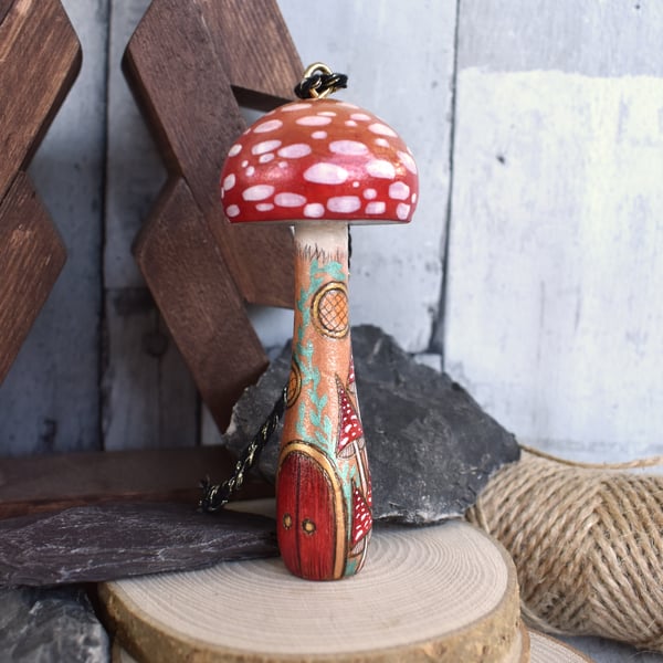 Large red mushroom with fairy door. Pyrography hanging toadstool decoration.