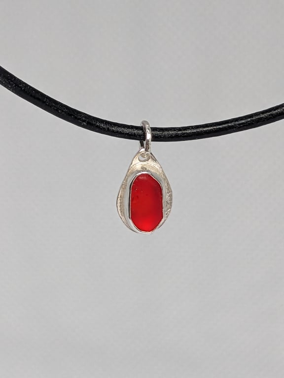 Tiny red sea glass sterling silver pendant