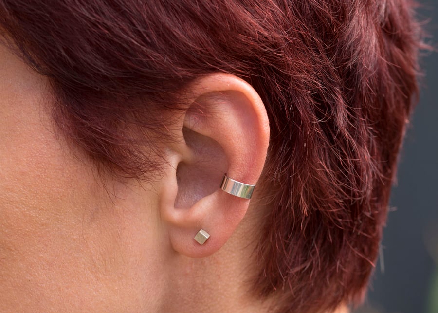 Slim silver ear cuff with a highly polished mirror finish