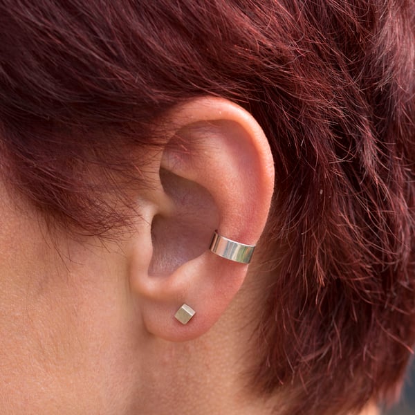 Slim silver ear cuff with a highly polished mirror finish