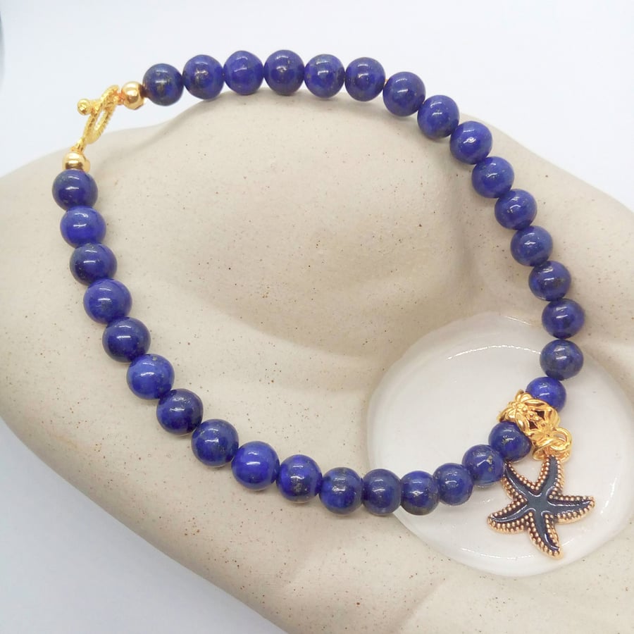 Lapis Lazuli Beaded Bracelet With A Gold Plated Enamelled Charm