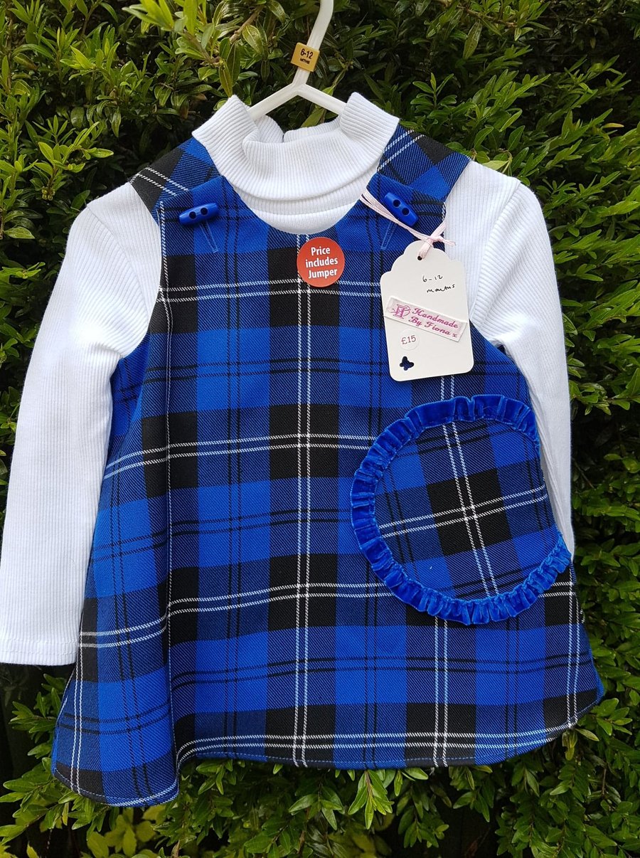 Age: 6-12m. Blue check tartan lined pinafore dress. 