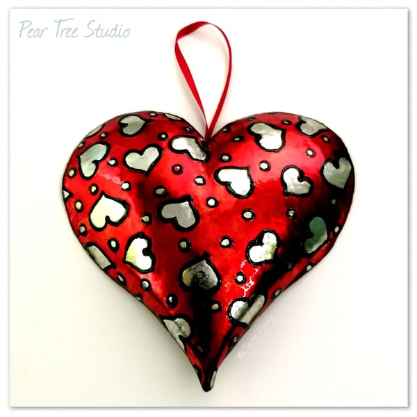 Handmade Small Red Metal Heart Hanging decoration with a heart pattern. 