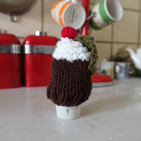 Hand knitted Christmas pudding egg cosy.