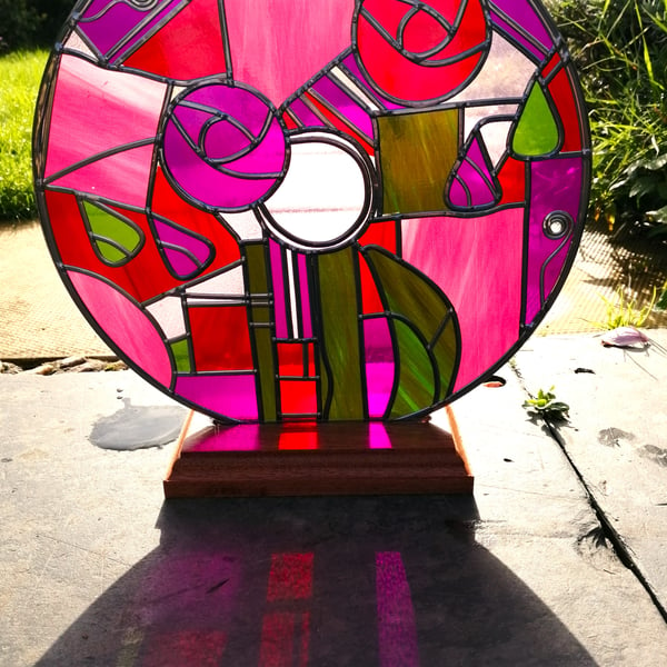 A Vibrant Marbled Free-Standing Stained Glass effect with a leaded design Window