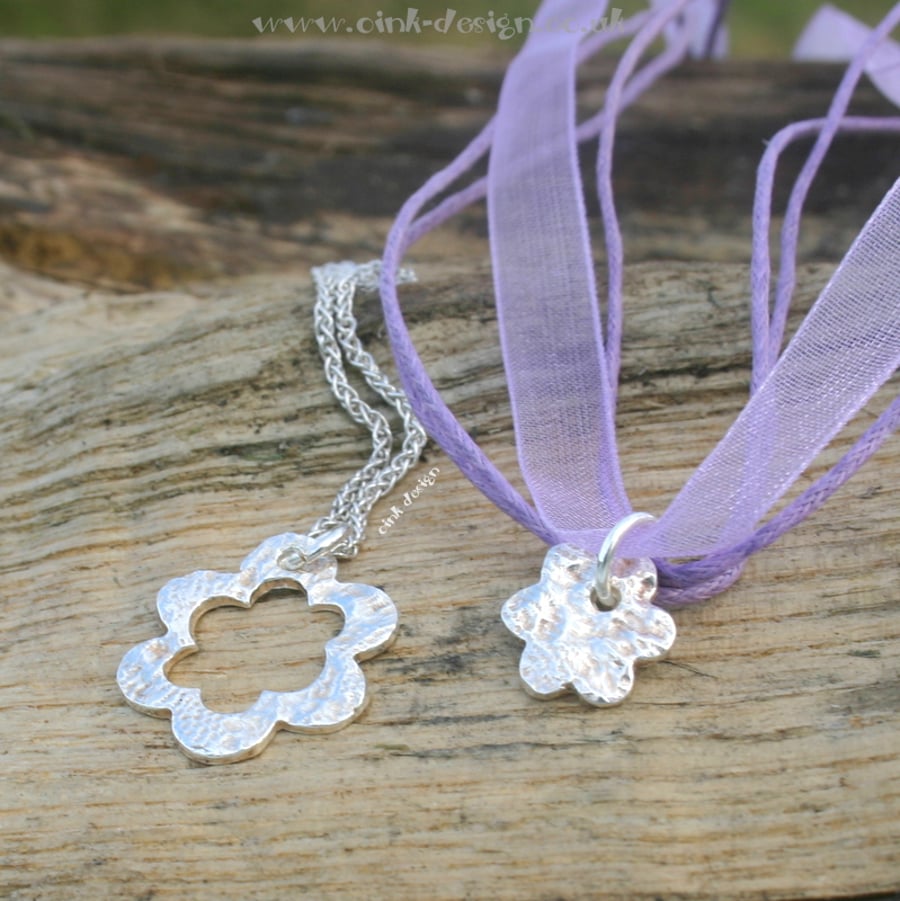 Mummy and Me. Two fine silver patterned flower pendants