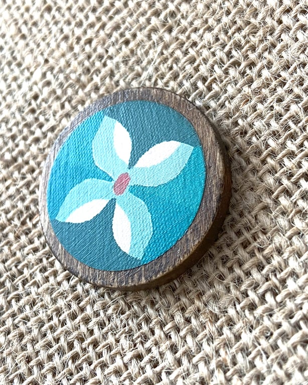 Wooden Floral brooch with blues and orange 