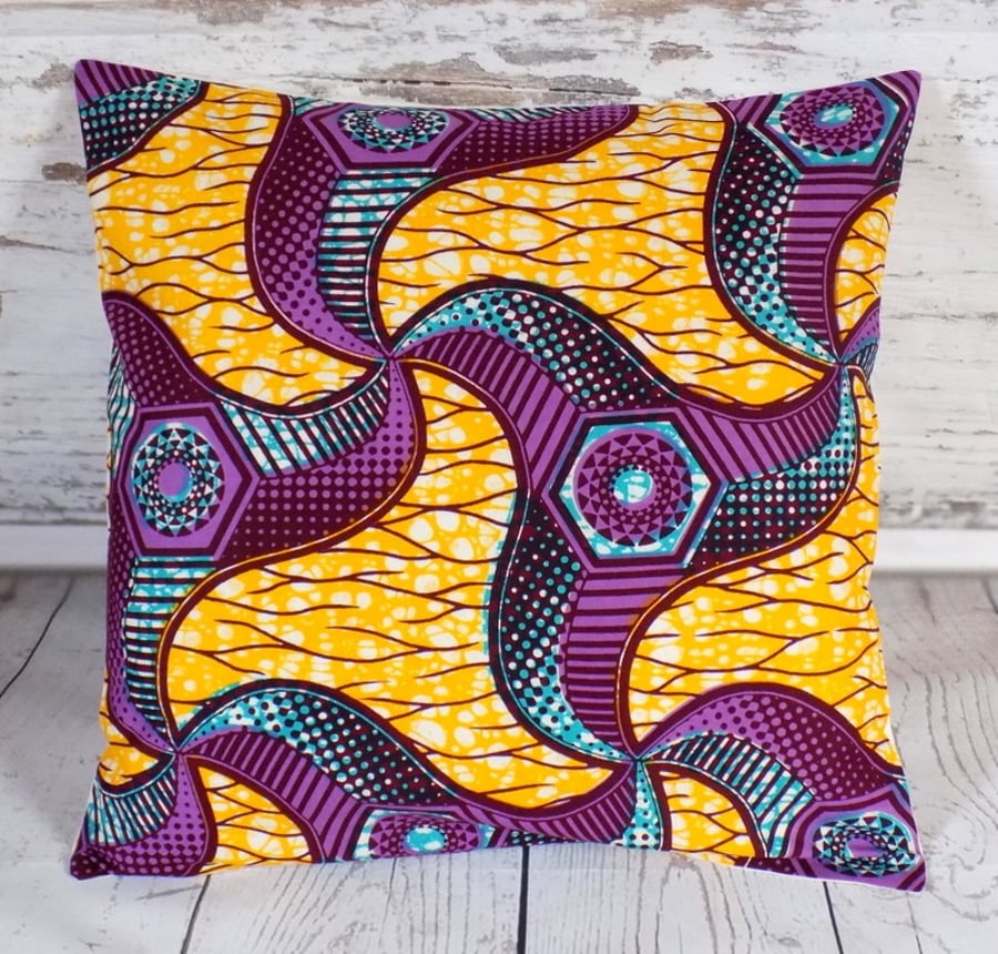 Cushion cover. African wax print, burgundy, purple, turquoise on yellow