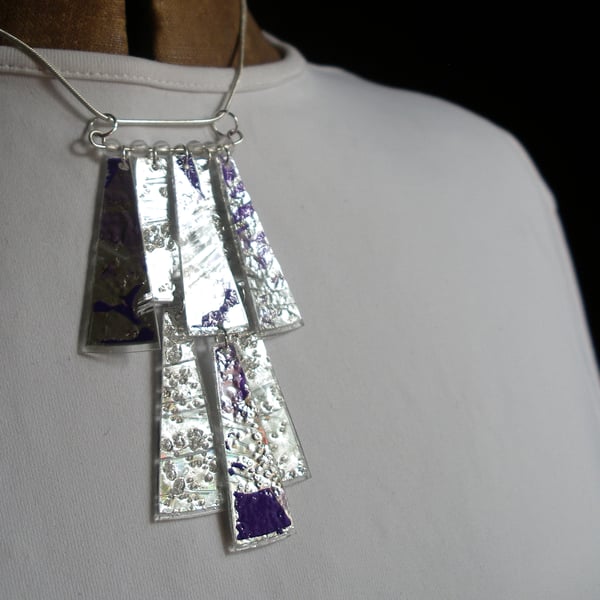Metallic silver and purple coloured pendant