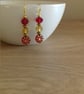 RED AND GOLD FLOWER GLASS BEAD EARRINGS. - Image 3