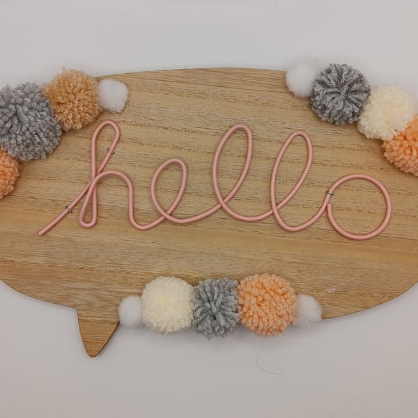 Pom pom hanging hello sign