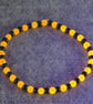 UV Reactive Orange Glass and Dark Metal Bead Elastic Bracelet - Image 5