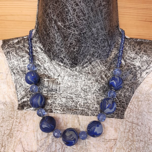 Handmade polymer clay and glass necklace in shades of blue