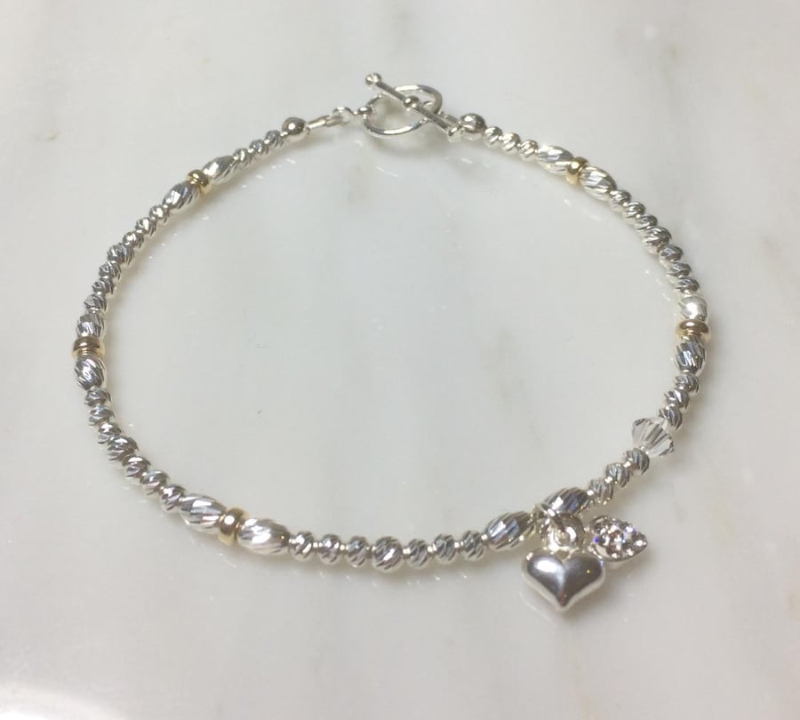 sterling silver twin heart charm bracelet