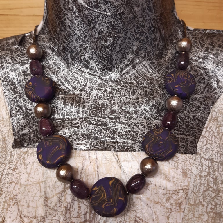 Purple, gold and black polymer clay disc shaped necklace 