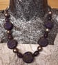Purple, gold and black polymer clay disc shaped necklace  - Image 1