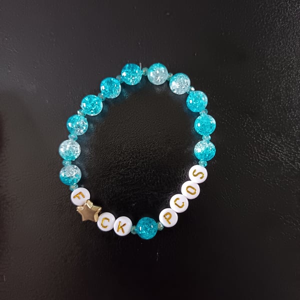 Elasticated PCOS letters bracelet with star detail and blue glass beads