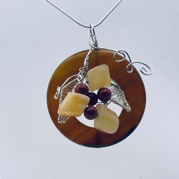 Large burnt orange gemstone and yellow floral wire art pendant