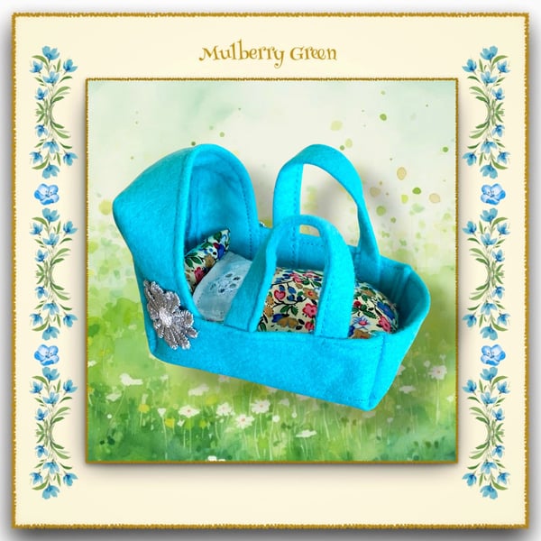 A Pretty Turquoise Felt Cradle for the baby Pip Squeaks and Cotton Tails