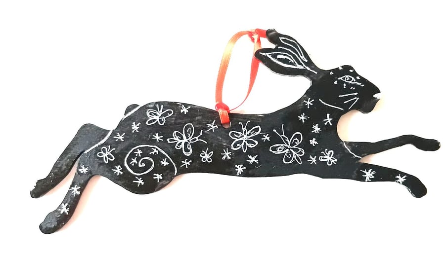 Hare with butterflies on wood